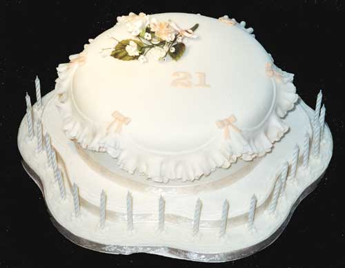 A 21st birthday cake with sugar crafted flowers.